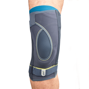 Push Sports Knee brace on man's knee showing the front of brace and showing the unique non-axial leaf-spring hinges close to the joint support both sides of the knee; U-shaped pad stabilizes the kneecap on both sides; Prevents brace slippage via internal 
